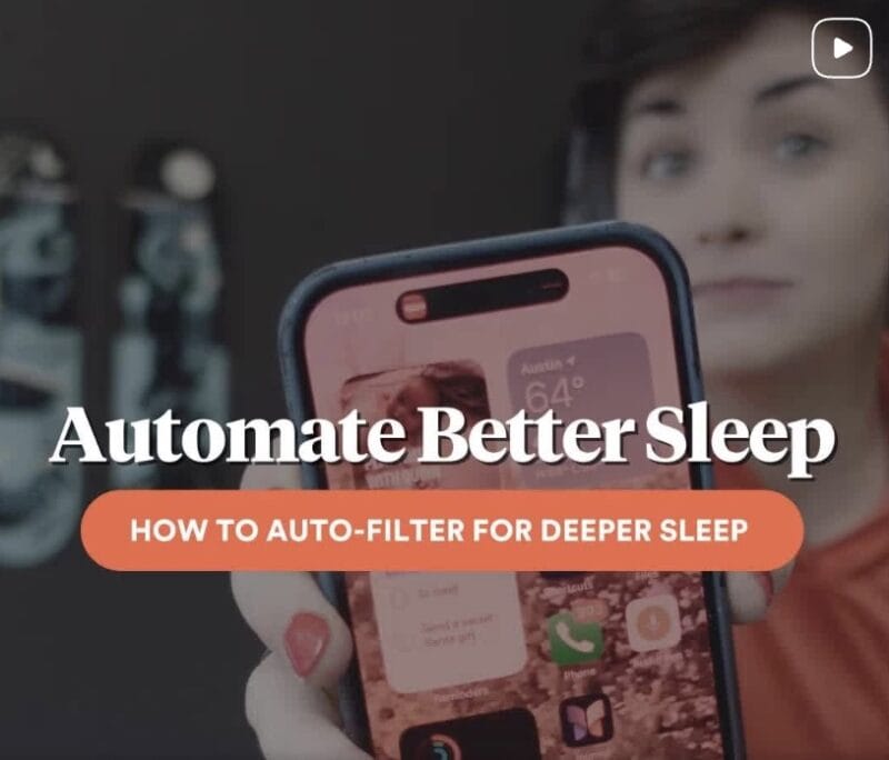Cathryn Lavery holding a smartphone toward the camera with on-screen text reading Automate Better Sleep and How to Auto-Filter for Deeper Sleep